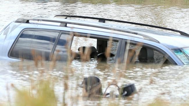 A car is submerged in a lake in Wyndham Vale. Picture: Mark Stewart