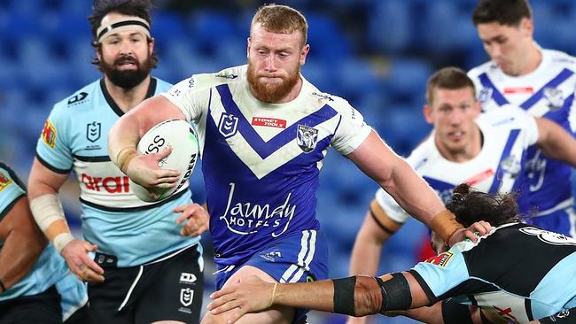 GOLD COAST, AUSTRALIA - JULY 25: Luke Thompson of the Bulldogs makes a break during the round 19 NRL match between the Canterbury Bulldogs and the Cronulla Sharks at Cbus Super Stadium, on July 25, 2021, in Gold Coast, Australia. (Photo by Chris Hyde/Getty Images)