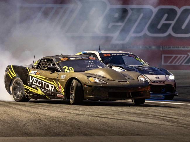 Patrick Barlee (grey Corvette) and Saxon drifting around a corner at the Gold Coast 500 Boost Mobile Pro Drift Slam, 2024. Picture: James Forester.