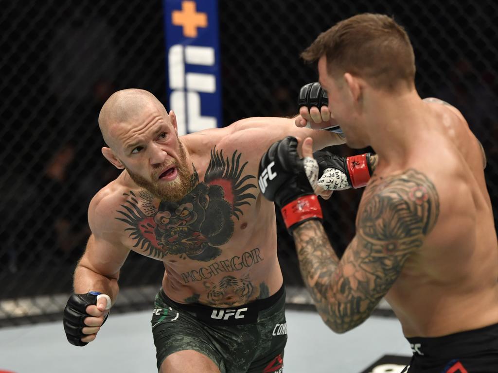 Conor McGregor punches Dustin Poirier at UFC 257.