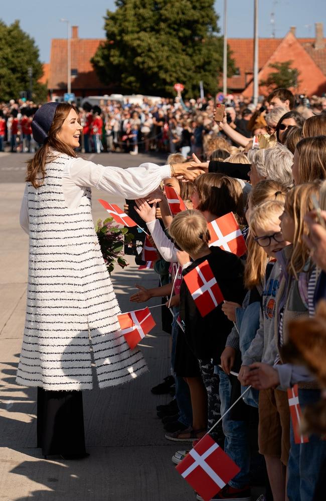 Queen Mary, dressed in a navy-inspired outfit, greeted children who were waving Danish flags. Picture: Instagram