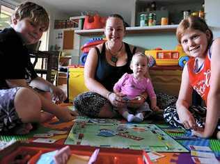 CUTTING COSTS: Tanya Norman, pictured with Parker Bailey, Charlotte Altoft and Hayley Altoft, turns to board games to keep family entertainment costs down. Picture: john mccutcheon