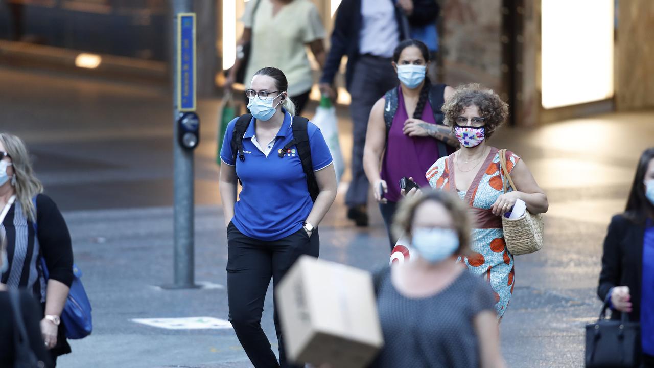 Pedestrians in the Brisbane CBD after masks became mandatory for all of Queensland. Picture: Josh Woning