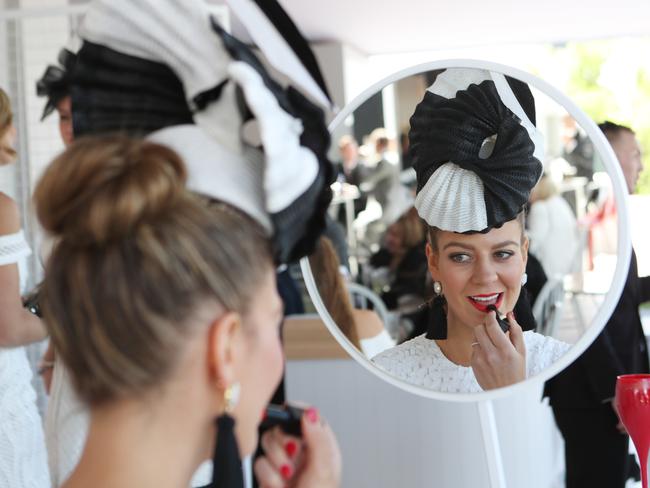 Kelli Odell touches up her makeup at Derby Day. Picture: David Crosling
