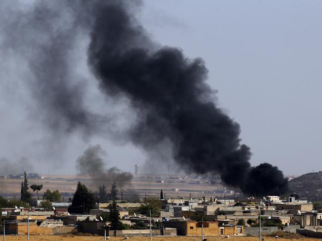 In this photo taken from the Turkish side of the border between Turkey and Syria, in Akcakale, Sanliurfa province, southeastern Turkey, smoke billows from targets inside Syria during bombardment by Turkish forces Thursday, Oct. 10, 2019. (AP Photo/Lefteris Pitarakis)