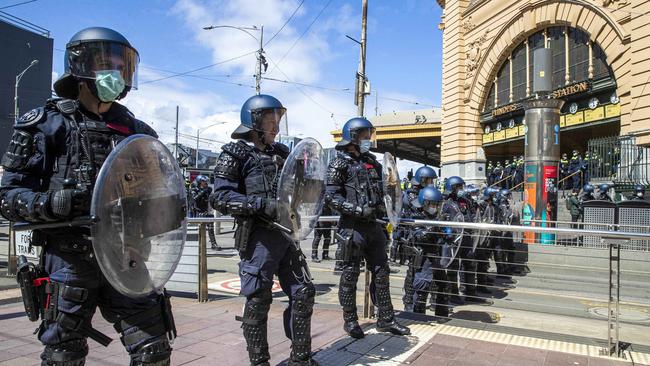 Specialist police formed a line outside Flinders Street Station. Picture: Aaron Francis/The Australian