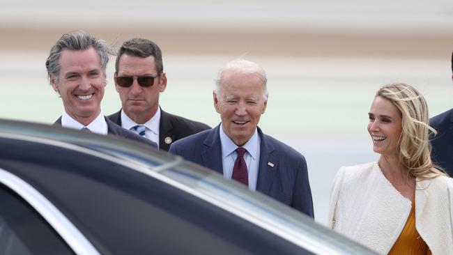 Joe Biden is welcomed to San Francisco on Tuedasy by Californian Governor Gavin Newsom and his wife Jennifer Siebel Newsom. Picture: AFP