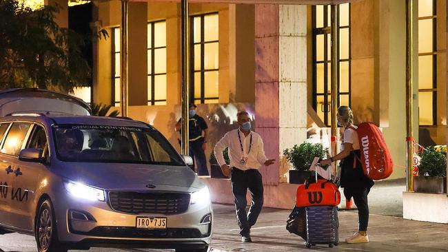 An Australian Open tennis player and family leave the View Melbourne Hotel in Albert Park after 14 days in quarantine. Picture: Ian Currie