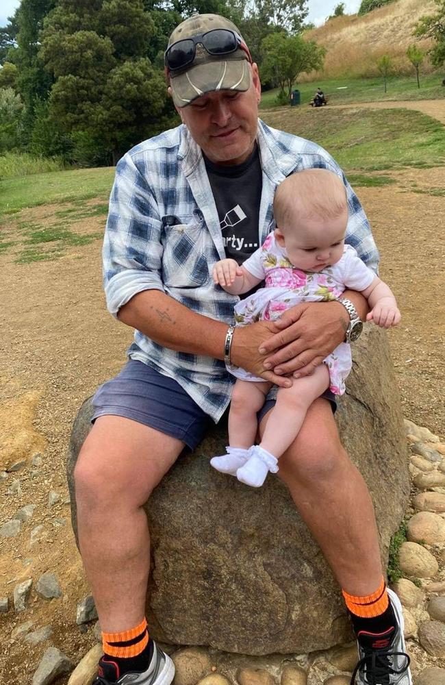 John Tscherkaskyj, more affectionately known as John Custard Jay, with his first grandchild. The Mercury delivery driver was tragically killed in a car accident on August 8. Source: SUPPLIED.