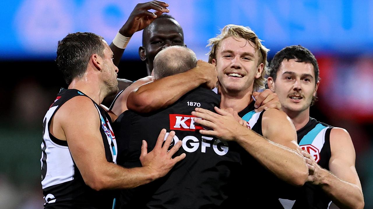 Port Adelaide coach Ken Hinkley celebrates with his players at full time. Picture: Brendon Thorne/AFL Photos/via Getty Images