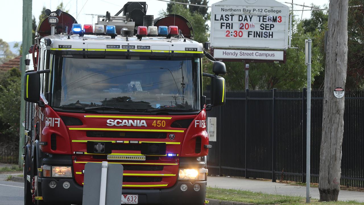 Firefighters returning to Northern Bay College’s Hendy St on Wednesday morning. Picture: Alison Wynd.