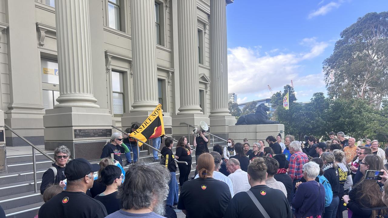 A large group met on the steps before the meeting.