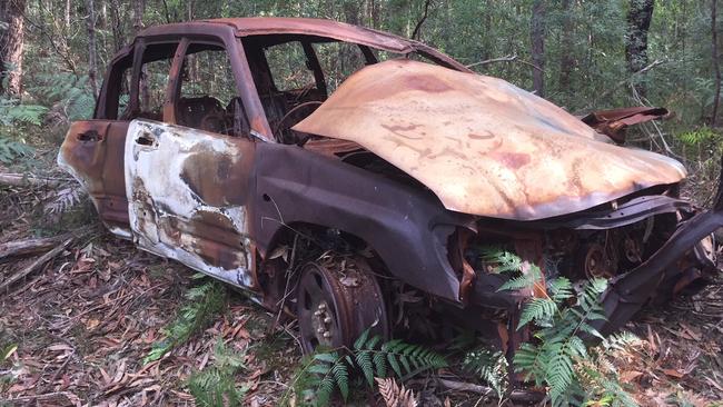 The burnt out Subaru found in bushland.