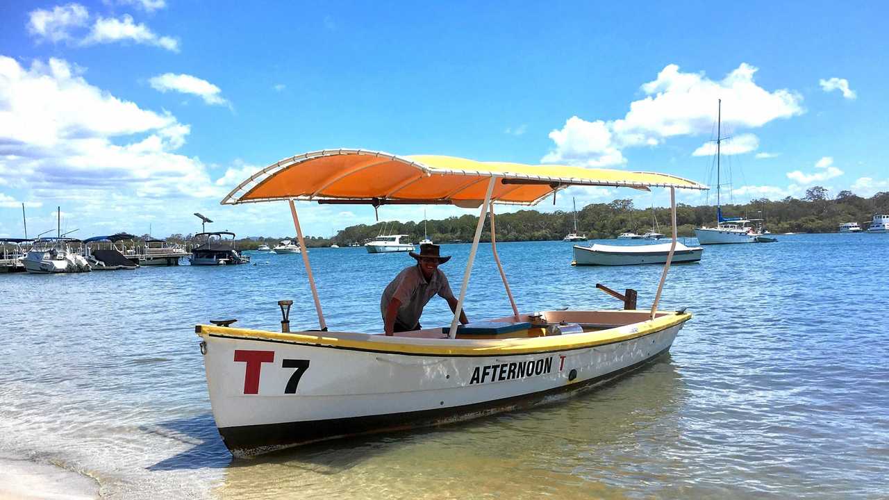 GOOD VIBRATIONS: Andrew Hosking with his restored T Boat on Noosa River.