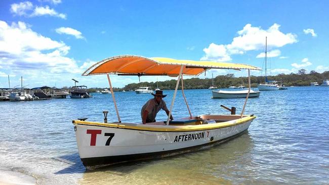 GOOD VIBRATIONS: Andrew Hosking with his restored T Boat on Noosa River.