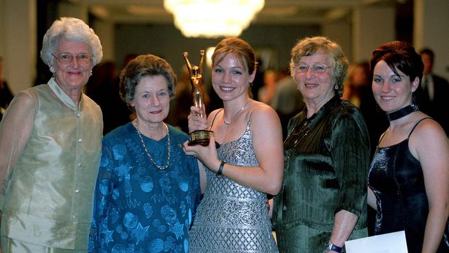 Norma Croker (left) and fellow 1956 relay gold medallists Fleur Mellor (second from left) and Shirley Strickland congratulate Courier-Mail Sportswoman of the Year 2002 Kerrie Meares (centre) and emerging sportswoman scholarship winner Anna Meares.