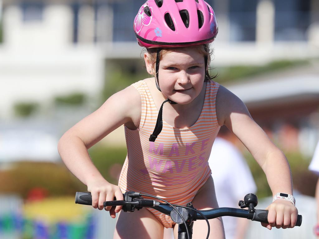 Participants competing in the Bupa KidFit Series triathlon beginning their cycling leg at Blackmans Bay Beach. Picture: LUKE BOWDEN