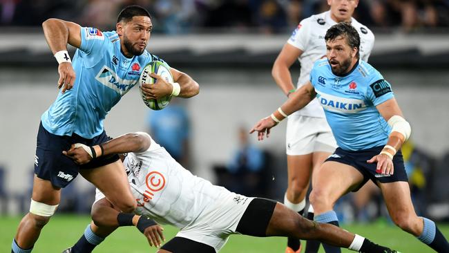 The Waratahs’ Curtis Rona is tackled as Adam Ashley-Cooper looms in support. Picture: AAP 