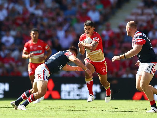 BRISBANE, AUSTRALIA - MARCH 05: Jeremy Marshall-King of the Dolphins is tackled during the round one NRL match between the Dolphins and Sydney Roosters at Suncorp Stadium on March 05, 2023 in Brisbane, Australia. (Photo by Chris Hyde/Getty Images)