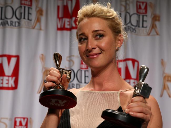 Asher Keddie beams as she holds Logies.