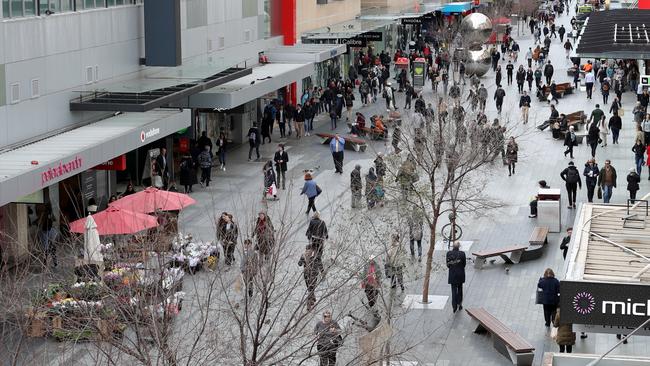 Pedestrians are seen in Rundle Mall in Adelaide, Tuesday, August 7, 2018. AAP Image/Kelly Barnes.