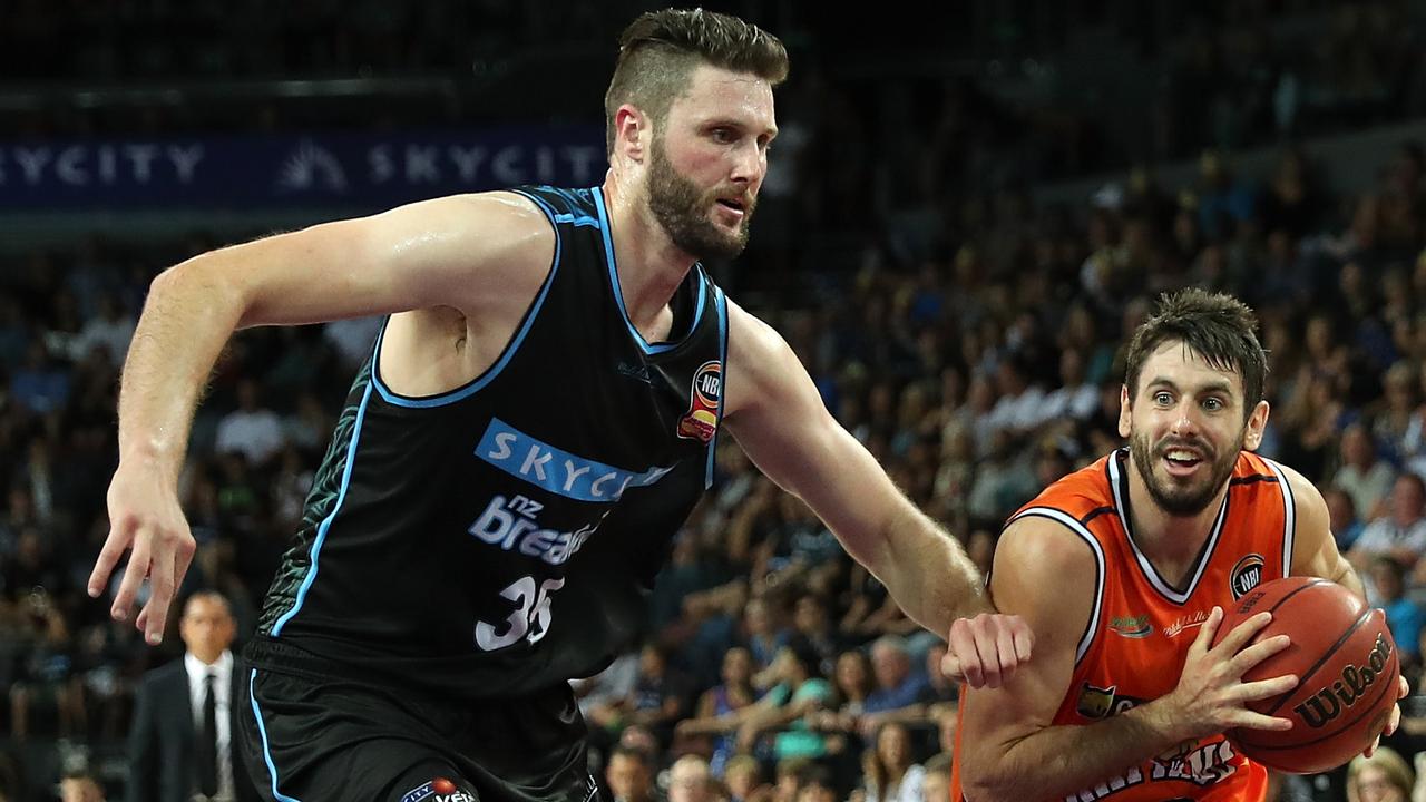 Alex Pledger (left) guards the basket for the Breakers. Picture: AAP