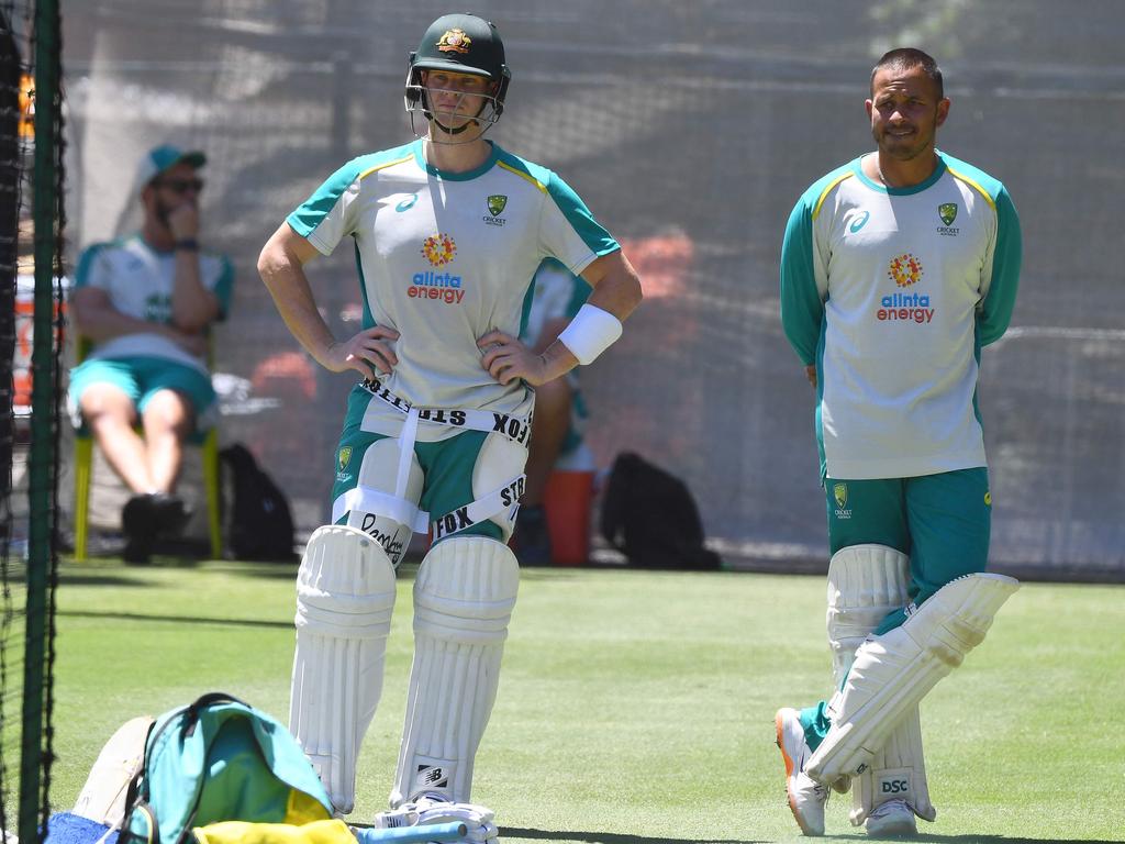 (L-R) Steve Smith and Usman Khawaja wait for a net practice during a training session. Picture: William West/AFP