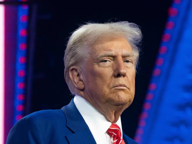 PHOENIX, ARIZONA - DECEMBER 22: U.S. President-elect Donald Trump looks on during Turning Point USA's AmericaFest at the Phoenix Convention Center on December 22, 2024 in Phoenix, Arizona. The annual four day conference geared toward energizing and connecting conservative youth hosts some of the country's leading conservative politicians and activists.   Rebecca Noble/Getty Images/AFP (Photo by Rebecca Noble / GETTY IMAGES NORTH AMERICA / Getty Images via AFP)