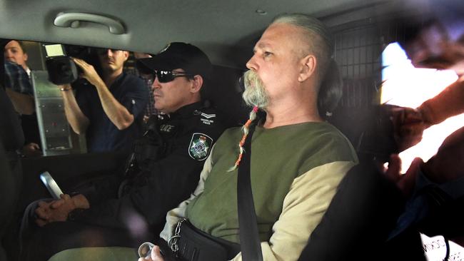 Troy James O’Meara, the man detectives have accused with the abduction and murder of Linda Reed in 1983, is driven by police to the Police Watch House in Brisbane, Wednesday, August 22, 2018. (AAP Image/Dave Hunt)