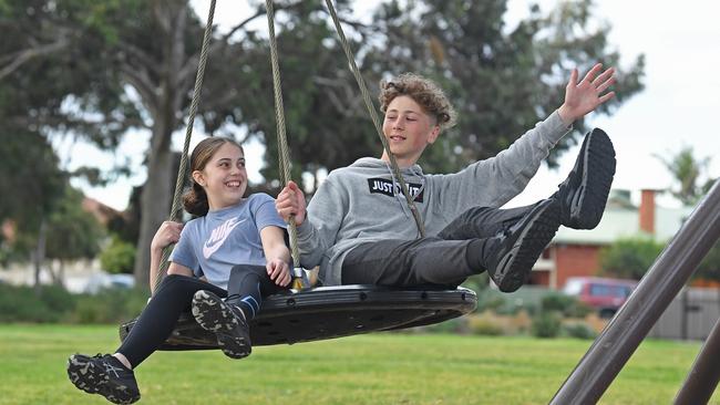 Not too old to play: Noah, 14, and Alana, 12, have some fun at Torrens Reserve in Flinders Park. Picture: Tom Huntley