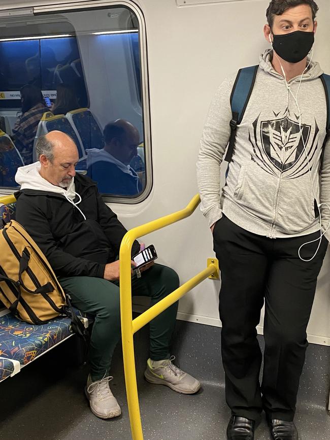 A commuter travelling the City Loop service without a mask on Wednesday, April 28, between 8am and 9am.