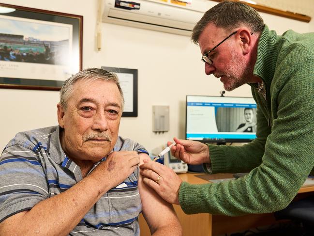 Michael Archer, 77 receiving the AstraZeneca COVID vaccine from Dr. Daniel Byrne at Chandler’s Hill Surgery in Happy Valley. Picture: Matt Loxton