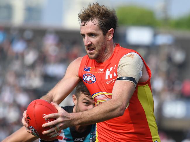 Michael Barlow of the Suns with the ball during the round 8 AFL match between the Gold Coast Suns and the Port Adelaide Power at Jiangwan Stadium in Shanghai, China, Sunday, May 14, 2017. (AAP Image/Tracey Nearmy) NO ARCHIVING, EDITORIAL ONLY