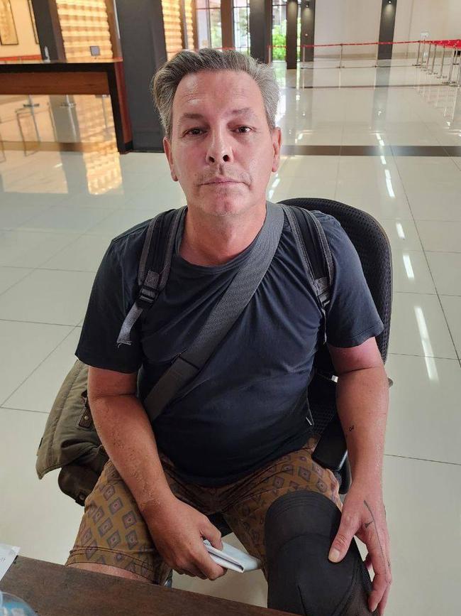 Ian Muldoon is pictured at the airport at Siem Reap, while being questioned by police over the broken ATM screen.