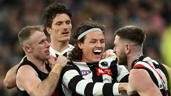 Essendon players tangle with Jack Ginnivan. Picture: Quinn Rooney/Getty Images.