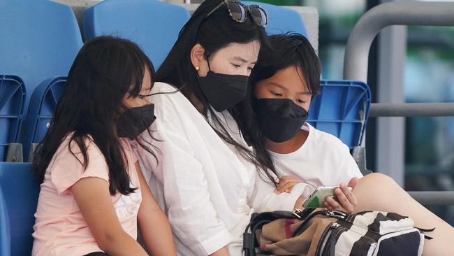 Many spectators at Melbourne Park wore face masks to combat the smoke. Picture: AAP