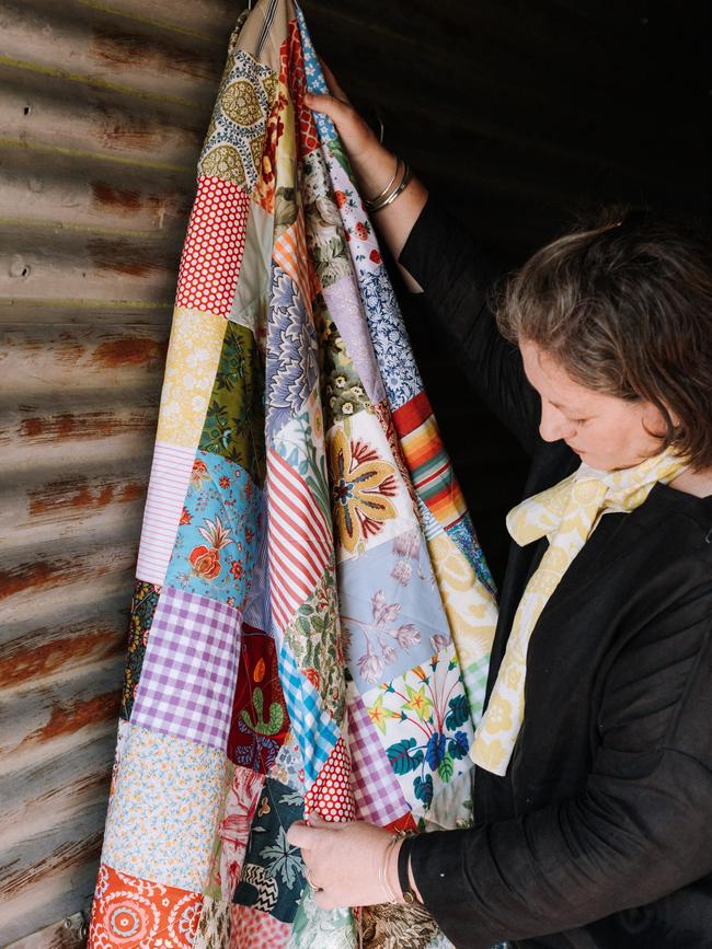 Sarah Stamm of Salisbury and Maude with her new quilt designs.
