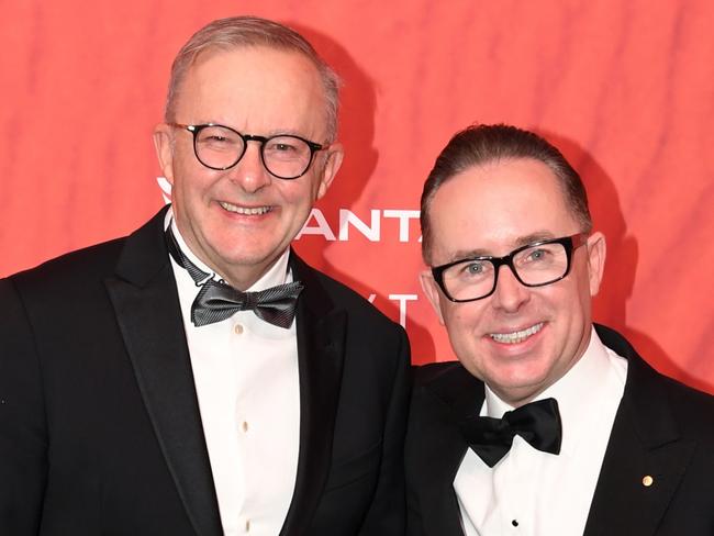 SYDNEY, AUSTRALIA - MARCH 31: Australian Prime Minister Anthony Albanese (L) stands with Qantas CEO Alan Joyce as they attend the Qantas 100th Gala Dinner at Jetbase 96 hangar at Sydney's International Airport on March 31, 2023 in Sydney, Australia. (Photo by James D. Morgan/Getty Images)