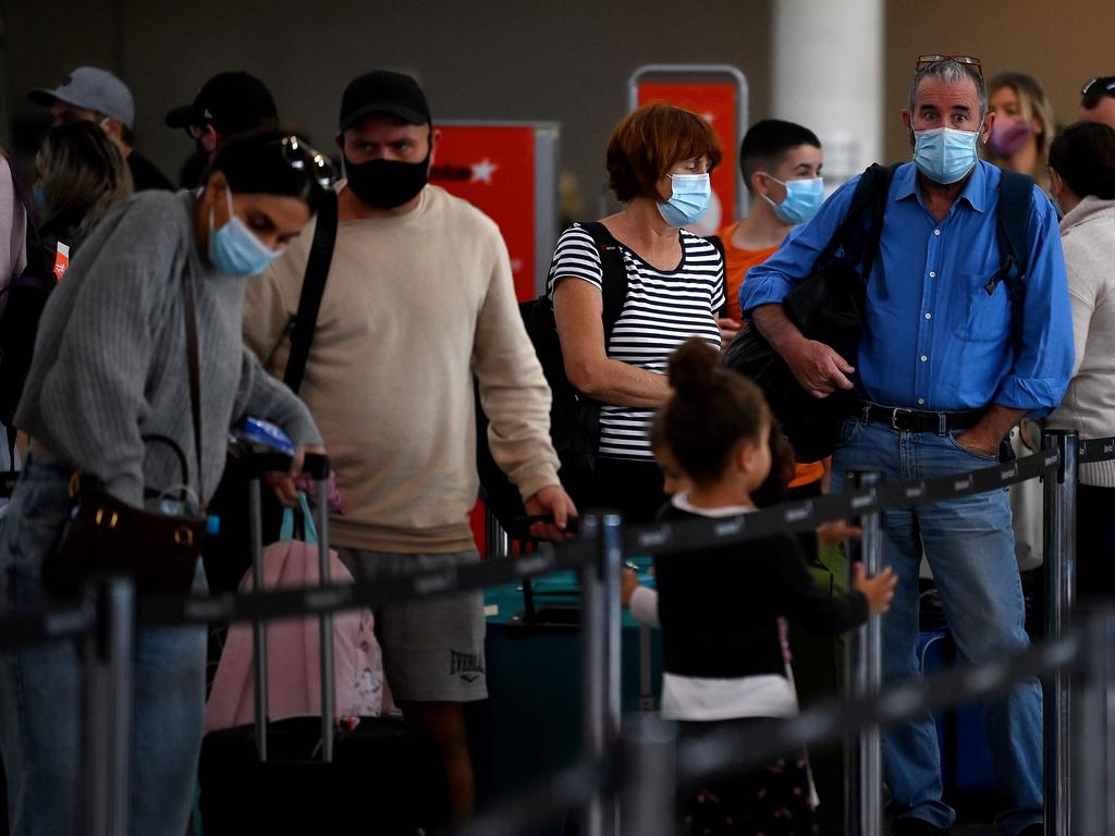 BESTSHOT - SYDNEY, AUSTRALIA - NewsWire Photos MAY, 08, 2021: People are seen wearing face masks to help prevent the spread of COVID-19 at Sydney Domestic Airport, Sydney. Mask wearing and gathering restrictions have been introduced in New South Wales, after authorities in the state announced a further locally-acquired COVID-19 case in the wife of a man who was announced Thursday. Picture: NCA NewsWire/Bianca De Marchi