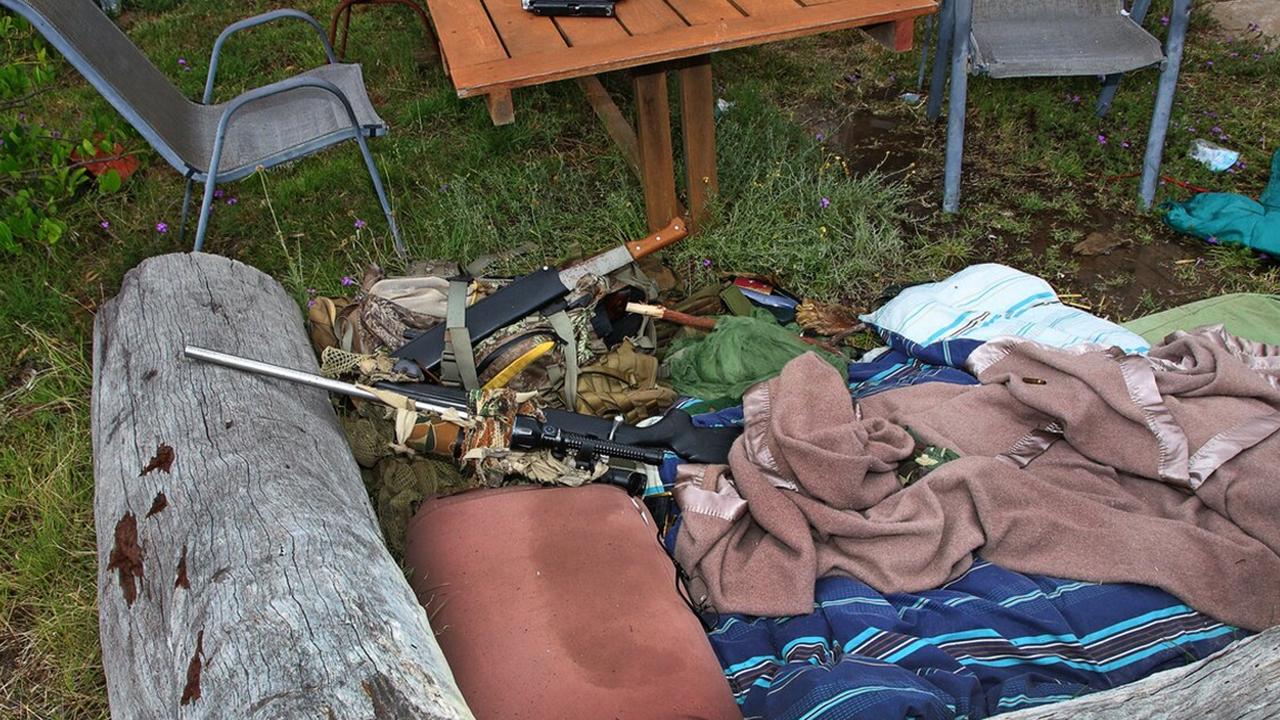 A rifle used by Nathaniel Train during the shootout with police, including the L-shaped log that he used as cover from approaching SERT teams. Picture: Supplied