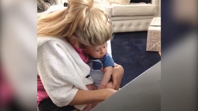 Tiffiny Hall plays piano for baby Arnie