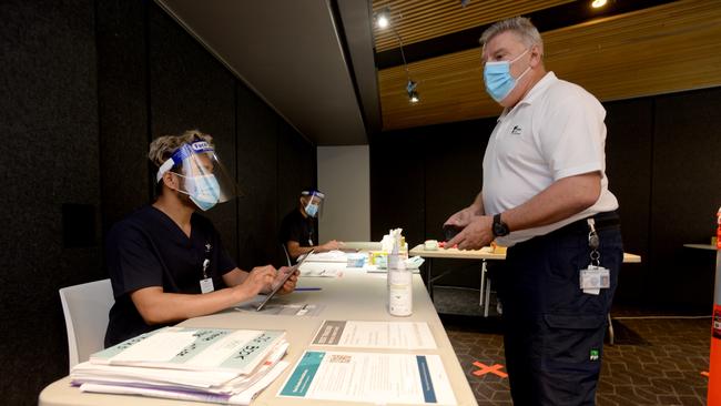 Healthcare staff working at the Four Points by Sheraton in Melbourne's Docklands get their daily COVID test as the hotel prepares to become a quarantine hotel. Picture: NCA NewsWire/Andrew Henshaw