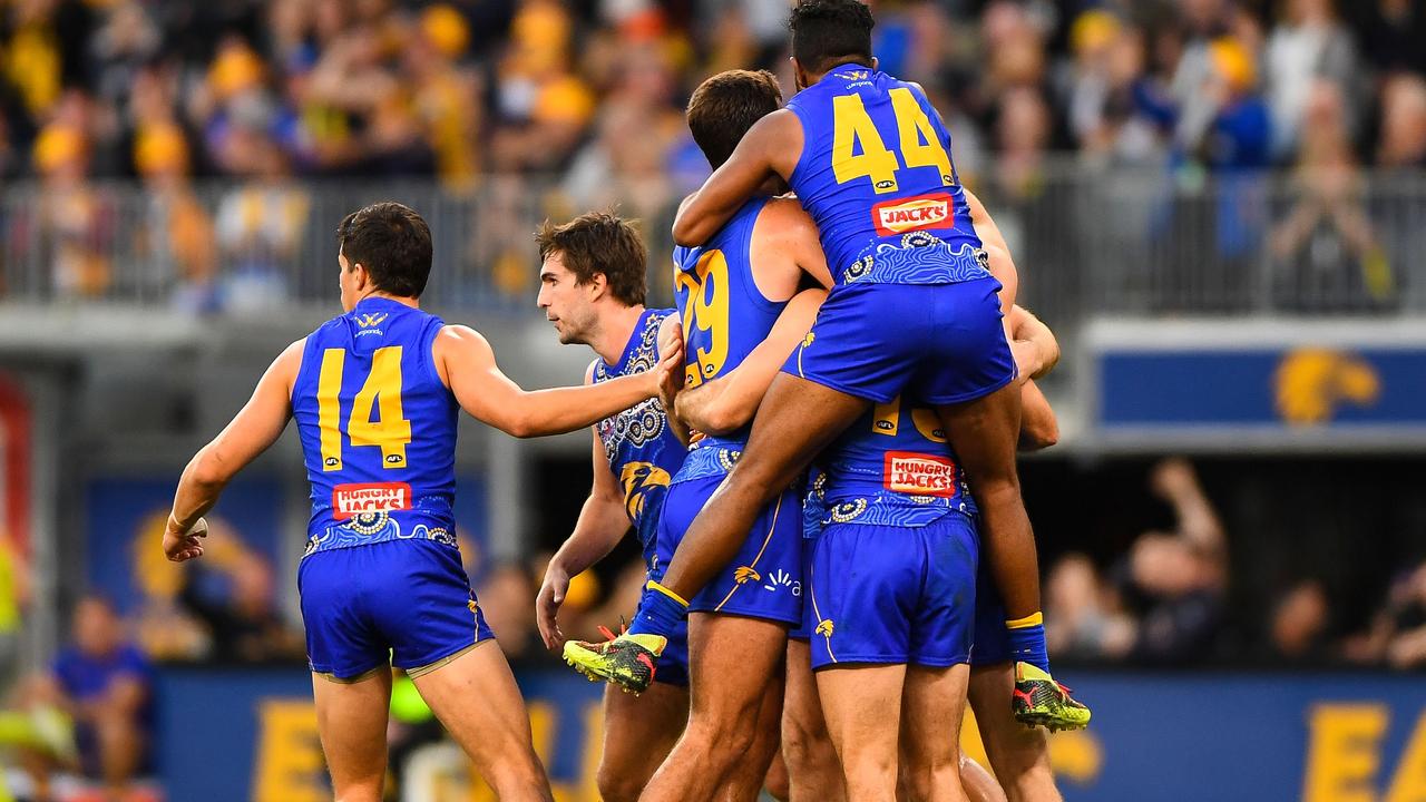West Coast players celebrate a late goal against Greater Western Sydney.