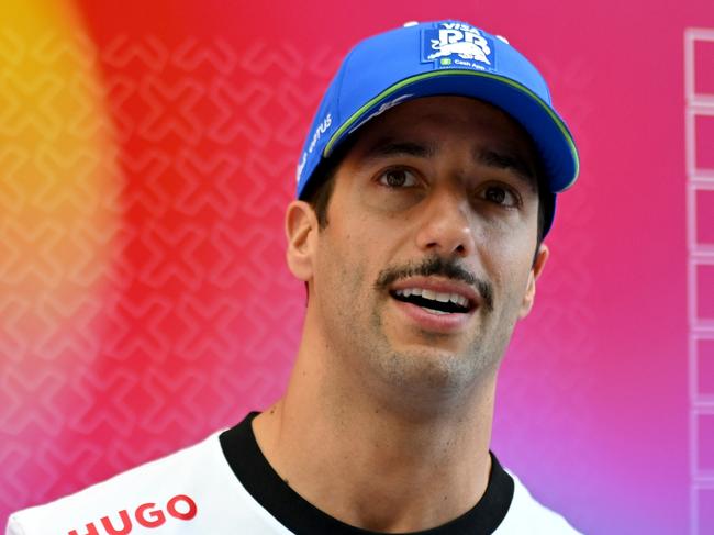 MIAMI, FLORIDA - MAY 02: Daniel Ricciardo of Australia and Visa Cash App RB talks to the media in the Paddock during previews ahead of the F1 Grand Prix of Miami at Miami International Autodrome on May 02, 2024 in Miami, Florida. (Photo by Rudy Carezzevoli/Getty Images)