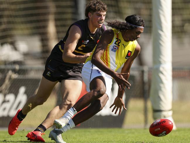 Johnston, playing for the NT Thunder, leads the Bushrangers’ Brayden George to the ball in April this year in Melbourne. Picture: Martin Keep/AFL Photos via Getty Images.