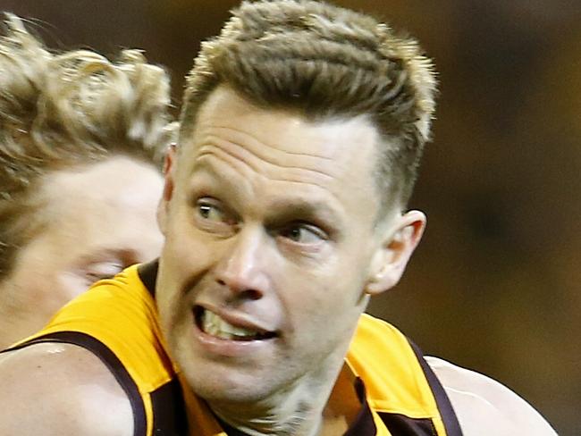 AFL Second Semi Final. Hawthorn vs Adelaide at the MCG. Sam Mitchell tries to break through the Rory Sloane tackle . Pic: Michael Klein. Friday September 18, 2015.
