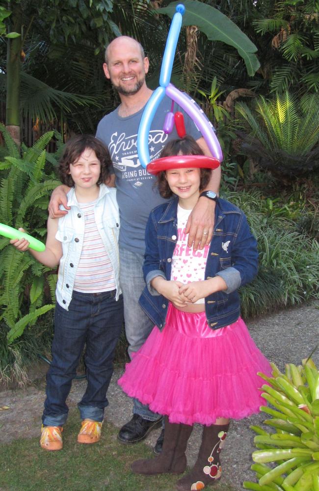 Matt Golinski and his twin daughters Willow and Sage.