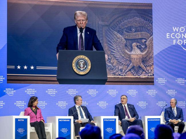 TotalEnergies chairman and CEO Patrick Pouyanne (2ndR) asks a question to US President Donald Trump (on screen) during his address by video conference at the World Economic Forum (WEF) annual meeting in Davos on January 23, 2025. Picture: AFP