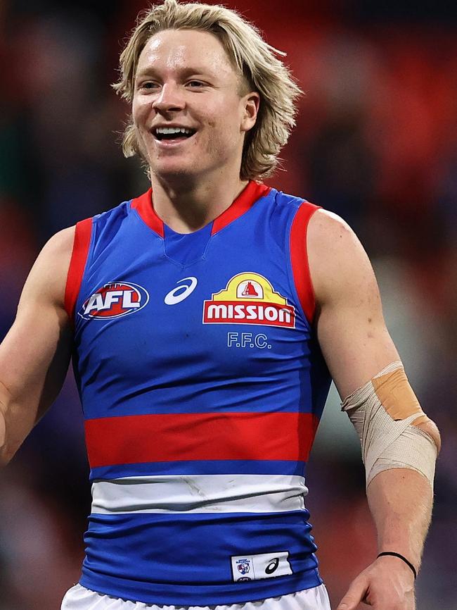 Weightman celebrates on the siren with his elbow strapped. Picture: Cameron Spencer/Getty Images