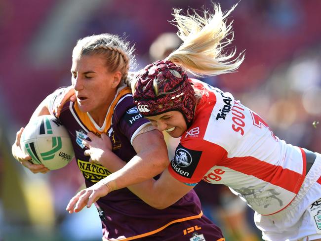 Ali Brigginshaw (left) of the Broncos is tackled by Hannah Southwell (right) during a tough match on September 9. Picture: AAP Image/Darren England